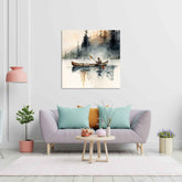 A canvas print depicting a painting with a person in a canoe on a lake, displayed above a grey sofa with cushions, a wooden coffee table, and a pink lamp in a room with white walls and a wooden floor.