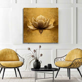 A canvas print featuring a golden lotus flower displayed in a room with two yellow chairs and a round table.