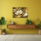 A canvas print featuring a floral design with gold and white colors, displayed on a wall in a room with a wooden floor and a wooden shelf with plants and bottles.