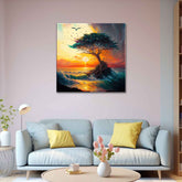 A canvas painting featuring a tree against a sunset background, with vibrant colors and dynamic brushstrokes, displayed above a grey sofa with yellow cushions.
