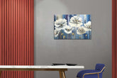 A canvas print featuring a colorful floral design displayed on a wall above a marble tabletop in a room with red wooden panels.