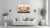 A canvas painting depicting an Indian nature scene with a moon, trees, and an elephant, displayed above a modern sofa in a room with minimalistic decor.