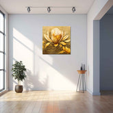 A canvas print depicting a golden lotus flower displayed in a well-lit room with a wooden floor and a potted plant to the side.