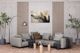 This image presents a tastefully decorated living room featuring a large, elegant canvas print titled "Fashionable Flower" by AKAR CREATION. The artwork is prominently displayed above a contemporary sofa, complemented by a wooden and metal floor lamp and a stylish potted plant.