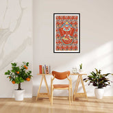 A canvas print featuring a colorful illustration of Lord Ganesha, displayed on a wall above a modern leather chair with orange plants and decorative items in a bright room.