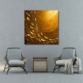 A canvas print featuring a geometric pattern with golden colors displayed in a room with two armchairs and a small table.