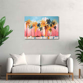 A vibrant canvas print featuring a painting of palm trees with a pink sky, displayed above a white sofa in a room with a neutral decor.