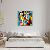 A colorful abstract painting featuring stylized faces with geometric shapes, displayed above a bed in a room with minimalist decor.