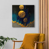 A canvas print featuring an abstract design with gold circles and blue background, displayed above an orange armchair.