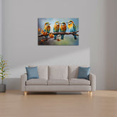 A canvas print featuring three colorful birds sitting on a branch, displayed above a gray sofa with blue cushions in a room with minimal decor.