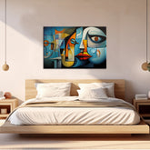 A modern abstract painting featuring geometric shapes and faces in various colors, displayed above a bed in a bedroom setting.
