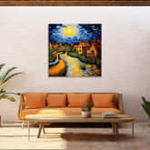 A canvas print depicting a vibrant painting of a village scene with houses and a church, under a blue sky with a prominent yellow moon, displayed on a wall above a modern sofa set.