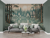A wall mural depicting a forest and lake scene with green, blue, and brown tones, applied on a wall behind a gray sofa.