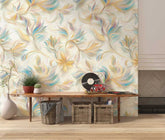 A cozy room with a beautiful floral wallpaper, showcasing a mix of pastel hues and swirling shapes, along with a wooden bench and decorative items.