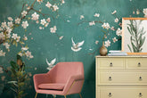 Room interior with a teal wall featuring floral and bird designs, a pink chair, and a beige dresser. Custom floral pattern wallpaper for living room decor
Peel and stick geometric wallpaper for kids bedroom
Nature-inspired wallpaper for home office walls