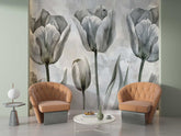 Modern living room with two orange chairs and a floral wall mural.
