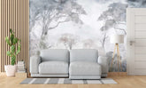 Gray sofa in a room with a large wall mural of trees and plants.