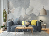 Modern living room with a gray sofa, wooden coffee table, and decorative wall art.