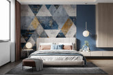 Modern bedroom with geometric wall art and a bed.