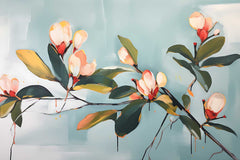 A canvas print of magnolia branches hanging on a wall above a grey sofa, with a white door and a potted plant in the background.
