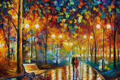 A canvas print featuring a colorful abstract representation of flower plants, displayed above a sofa in a living room setting.