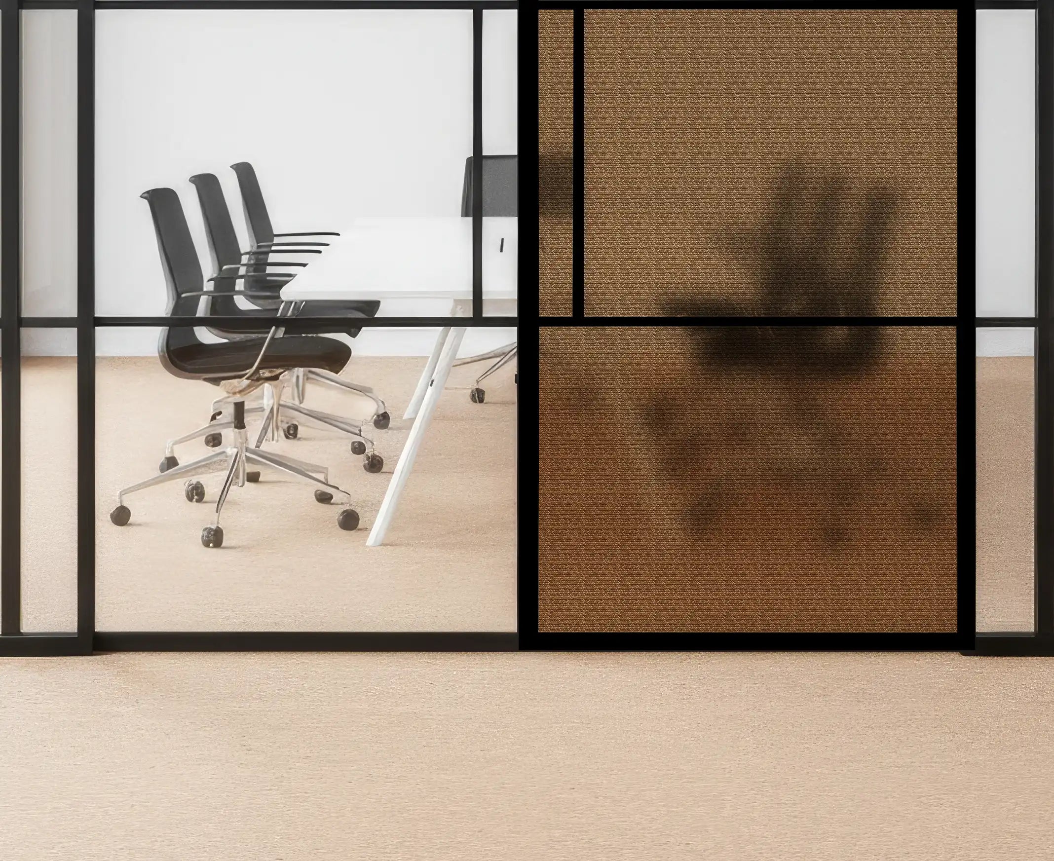 Modern office setting with glass walls, black chairs, and a white table.
