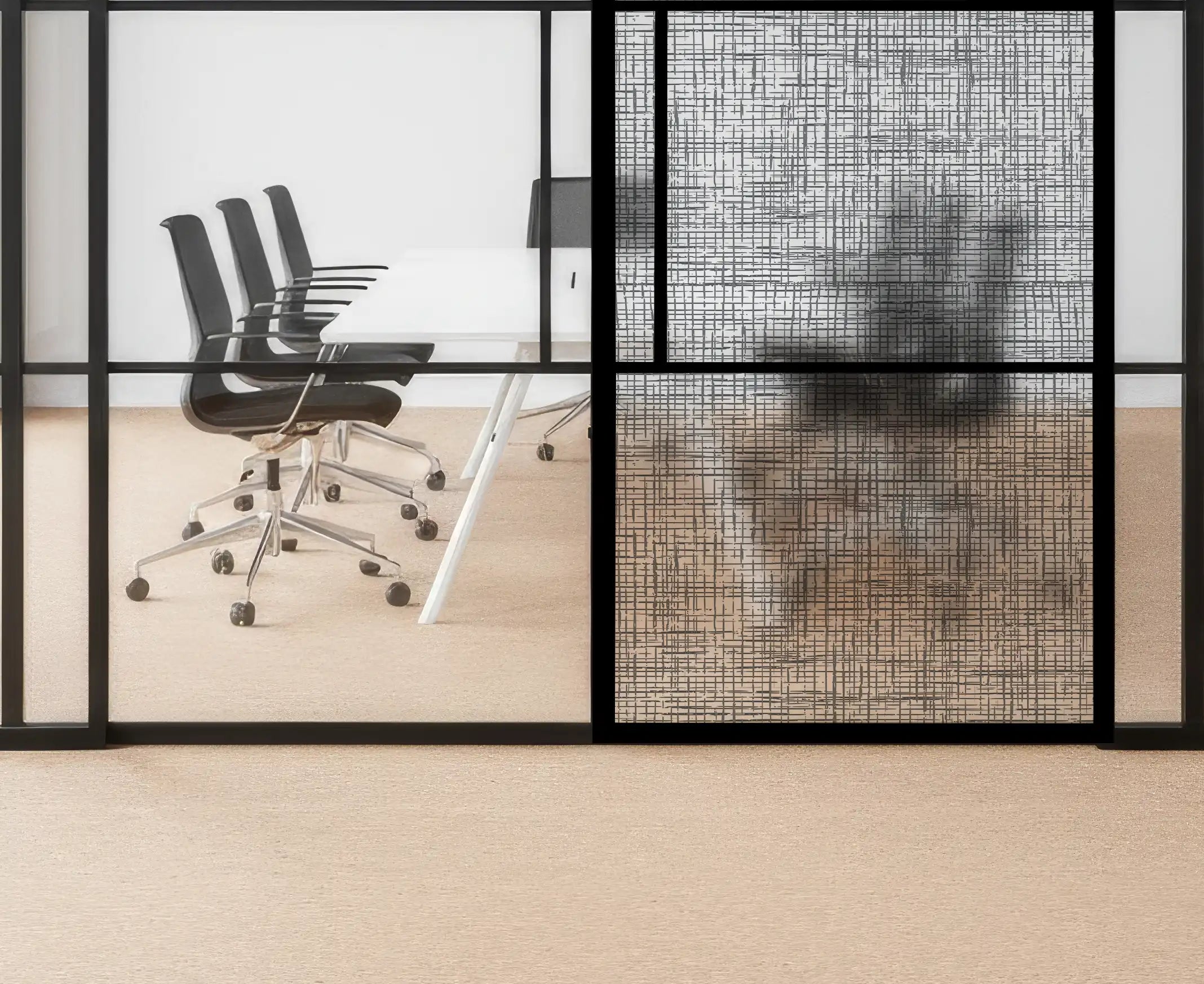 Modern office setting with glass walls, black chairs, and a white table.