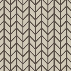 Pattern of black chevron lines on a beige background