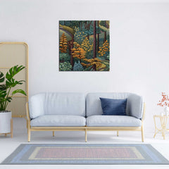 A framed 'Tranquil Forest Painting' hanging on a wall above a blue couch, with a potted plant and minimalist furniture in the background.