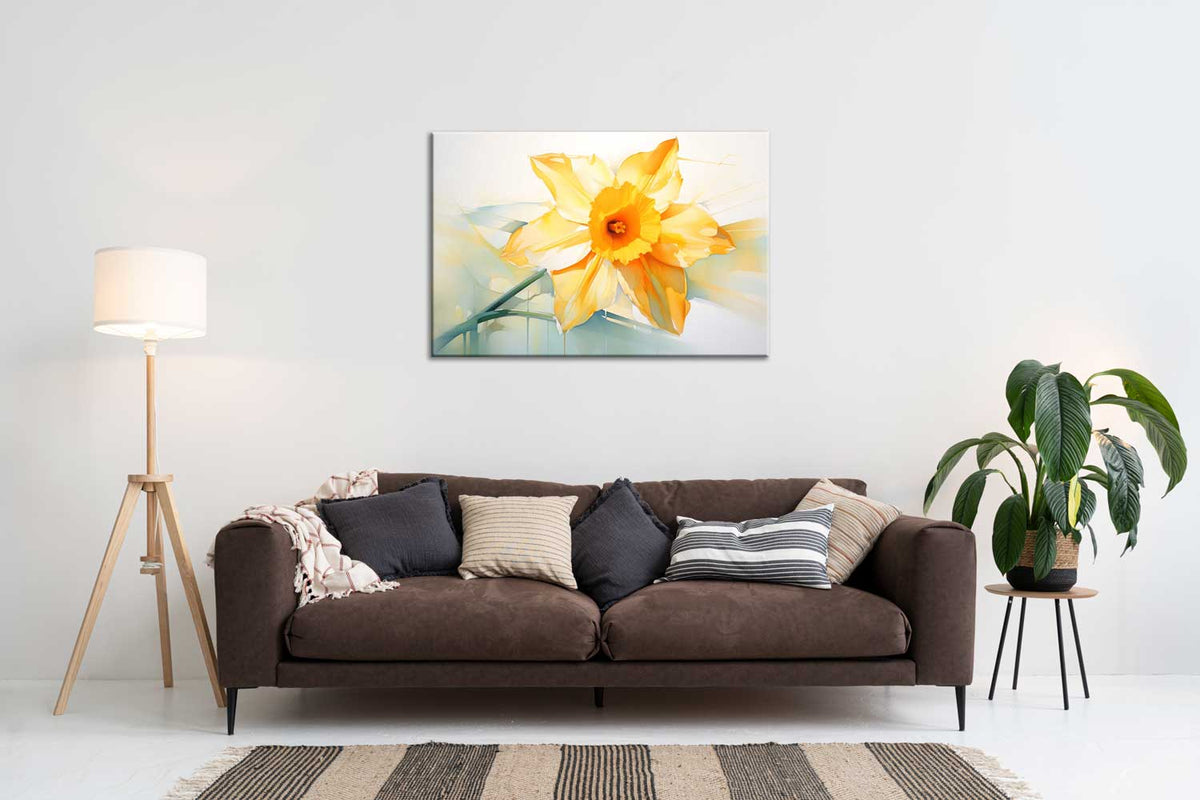A canvas print of a yellow flower displayed above a brown sofa in a room with a white wall, a lamp, and a plant.