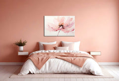 A canvas painting of a pink flower displayed above a bed in a room with pink walls.