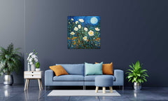 A canvas print featuring a vibrant floral scene with a nighttime background, displayed on a wall above a blue sofa in a well-lit living room setting.
