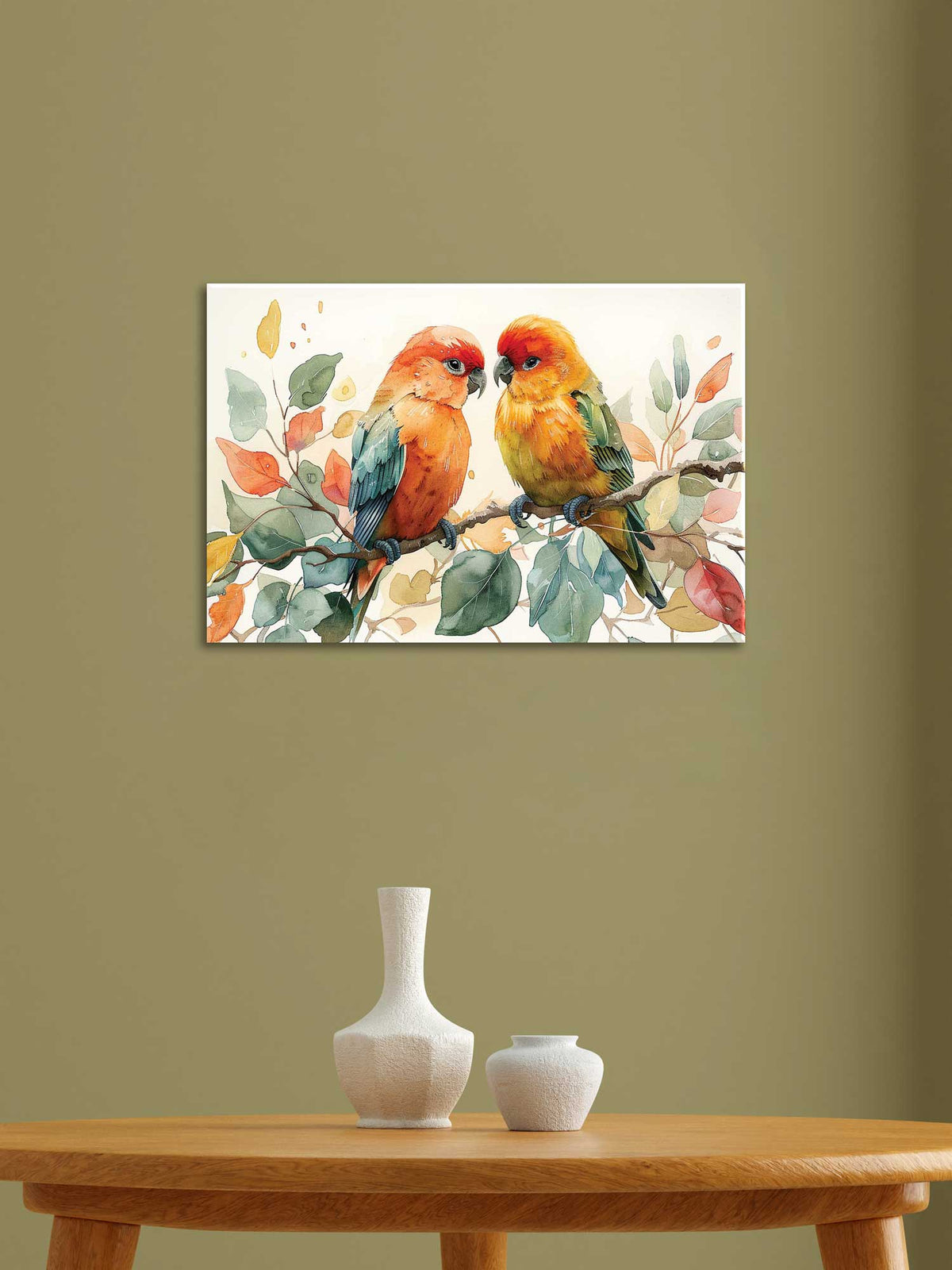 A canvas painting depicting two colorful birds perched on a branch, displayed on a wall above a table with a white vase and decorative items.