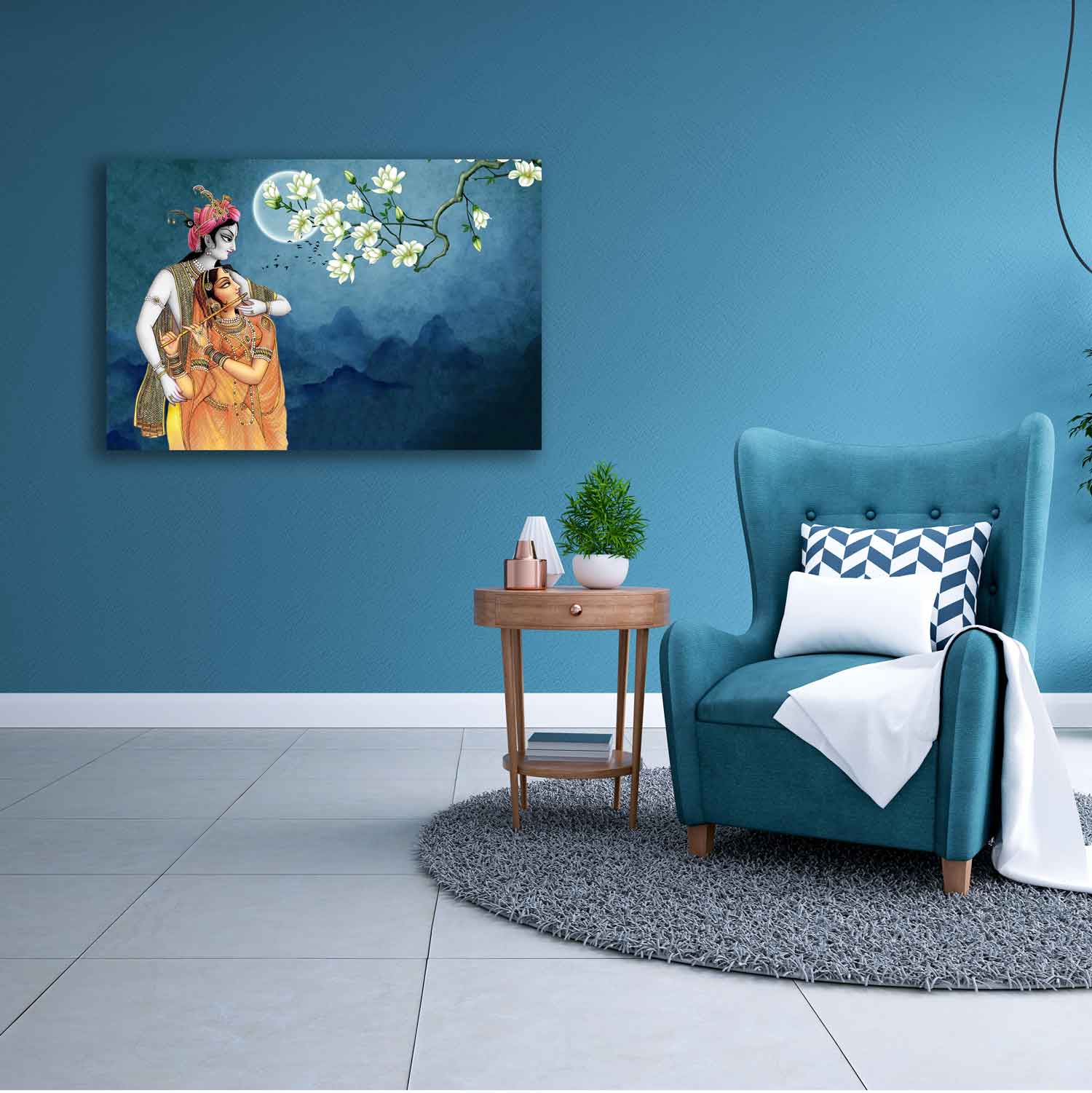 A canvas painting depicting two individuals in traditional attire hanging on a blue wall above a small table with a plant and a book. adjacent to a blue armchair with a white cushion.