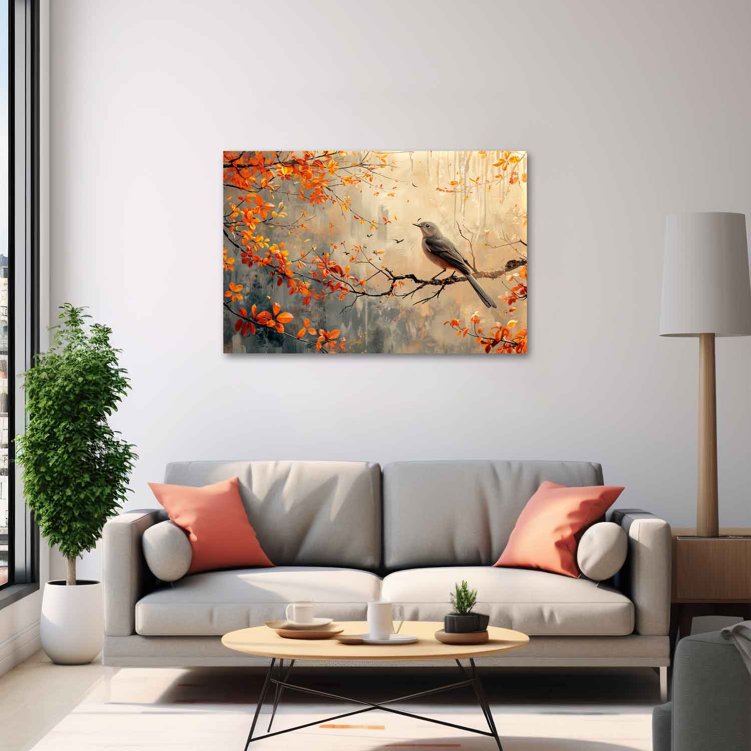 A canvas print depicting a bird perched on branches with orange leaves, displayed above a grey sofa with coral cushions.