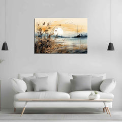 A canvas print featuring a sunset view with a representation of a calm lake and a silhouetted island, displayed above a modern white sofa in a minimalist living room setting.