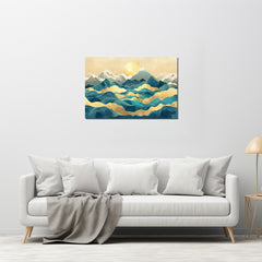 A canvas print featuring a mountainous landscape with a golden line in the sky, displayed on a wall above a white sofa with grey pillows.