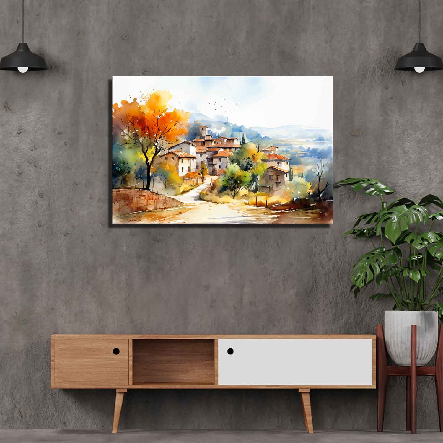 A canvas print depicting a landscape with a village and autumn trees, displayed on a gray wall in a modern interior setting.