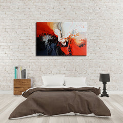 A modern abstract painting featuring predominantly black and red colors with white accents, displayed above a bed in a room with a white brick wall.