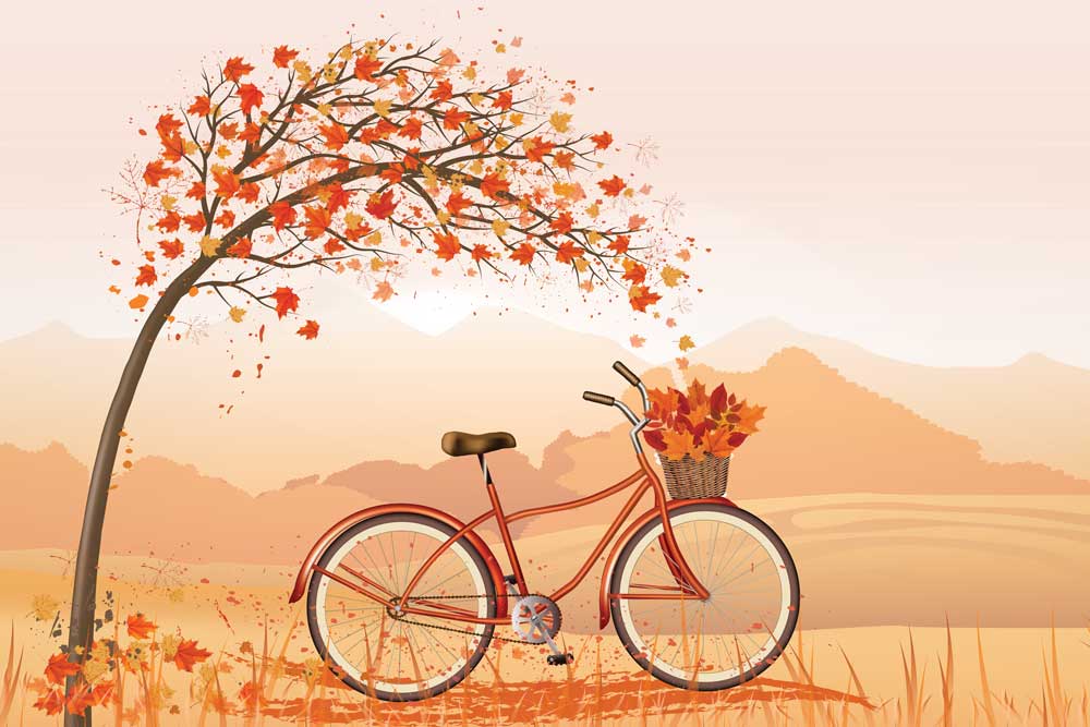 A beautiful autumn-themed wallpaper featuring a bicycle, tree, and rolling hills, adding a touch of warmth and coziness to a modern living room.