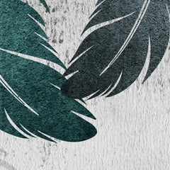Close-up of green leaves on a textured surface