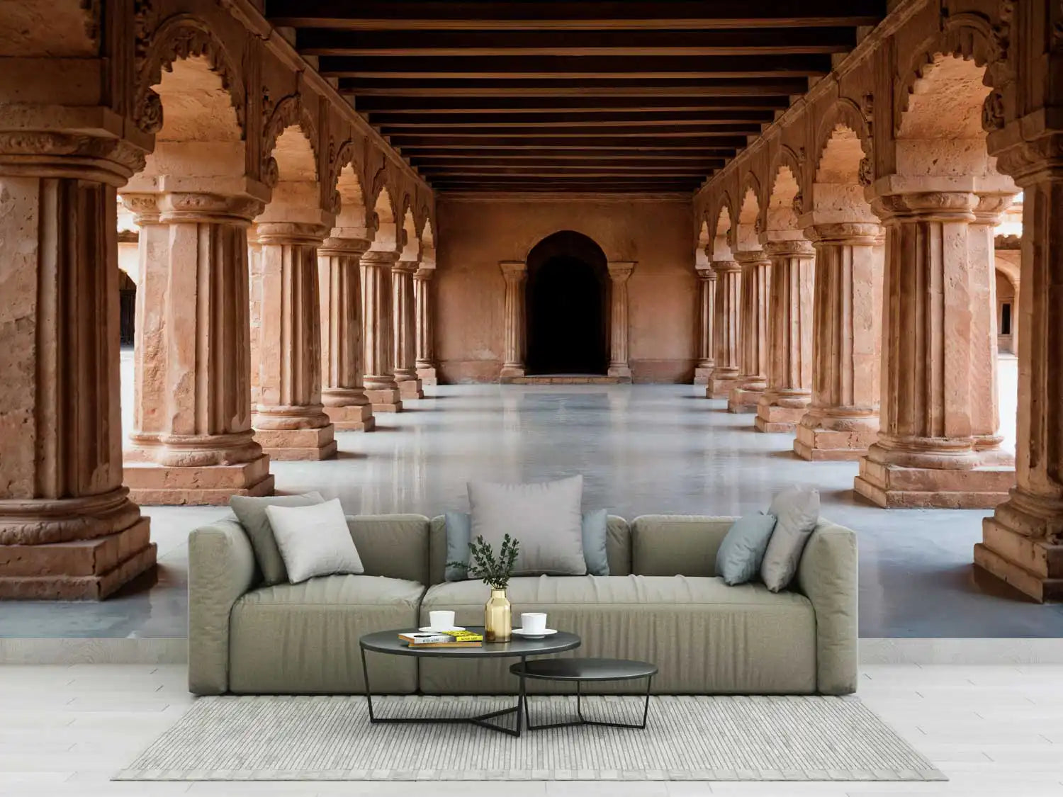 Modern sofa with decorative items in a historical architectural setting