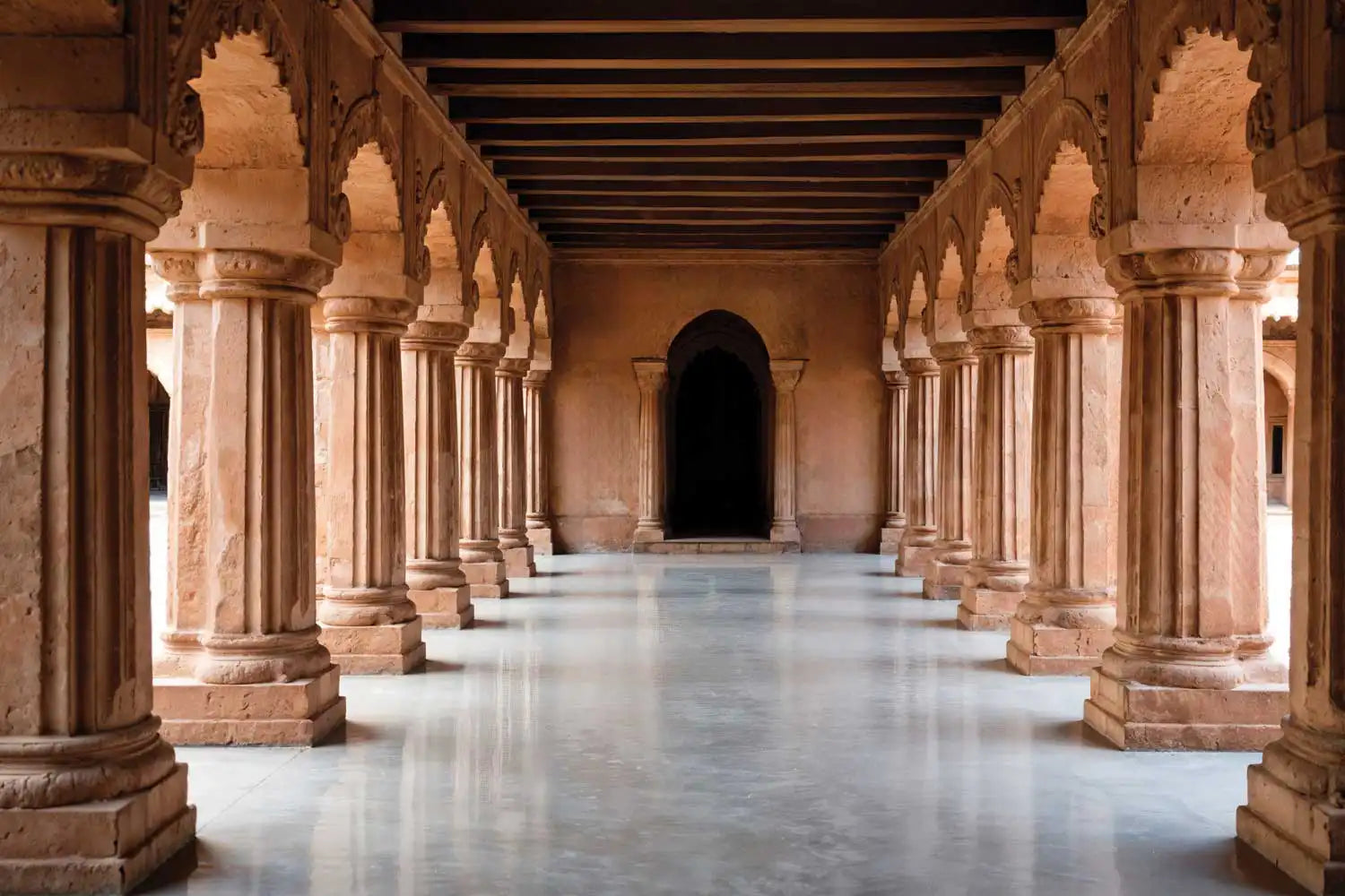 Long corridor with arches and columns in a historical building
