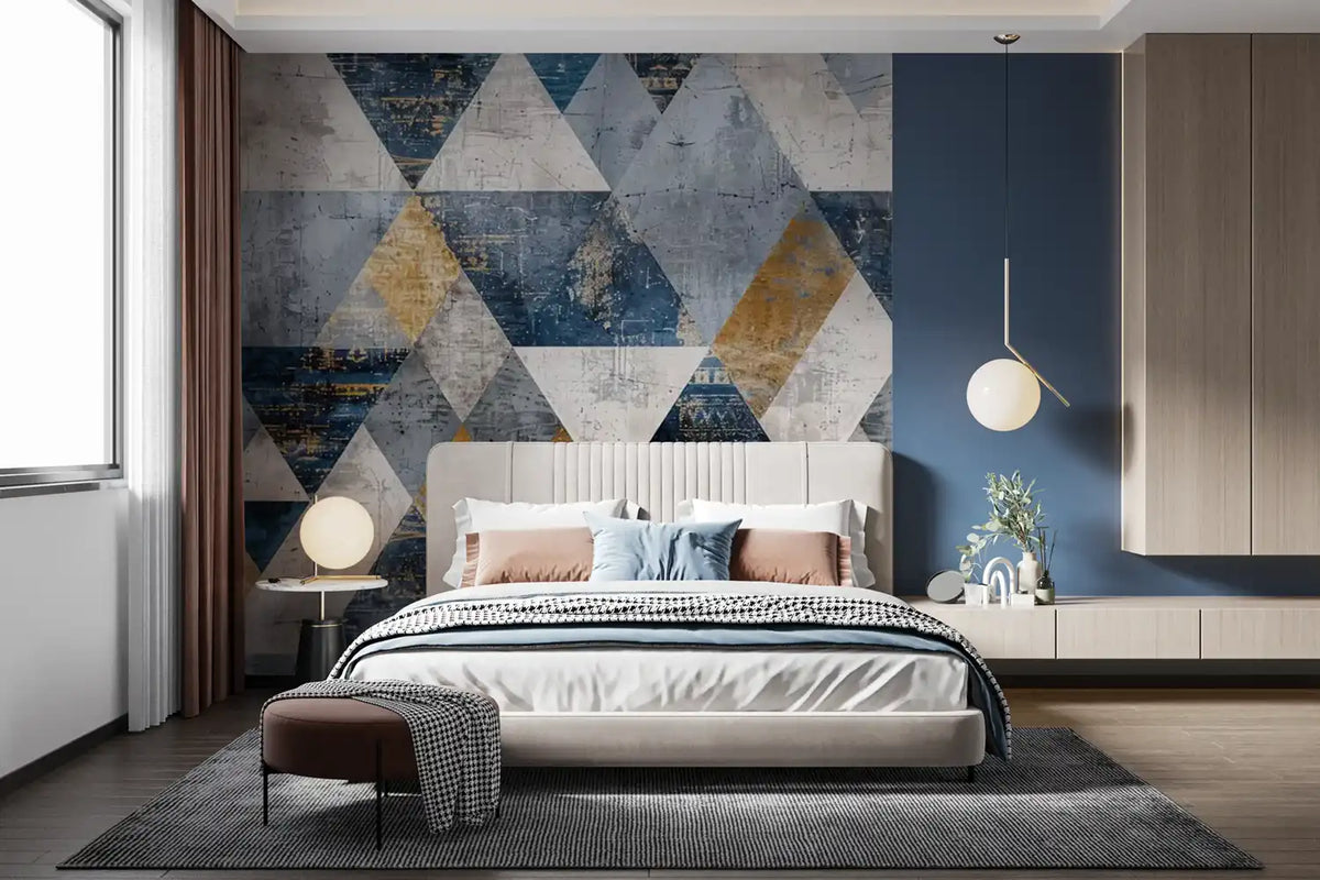 Modern bedroom with geometric wall art and a bed.