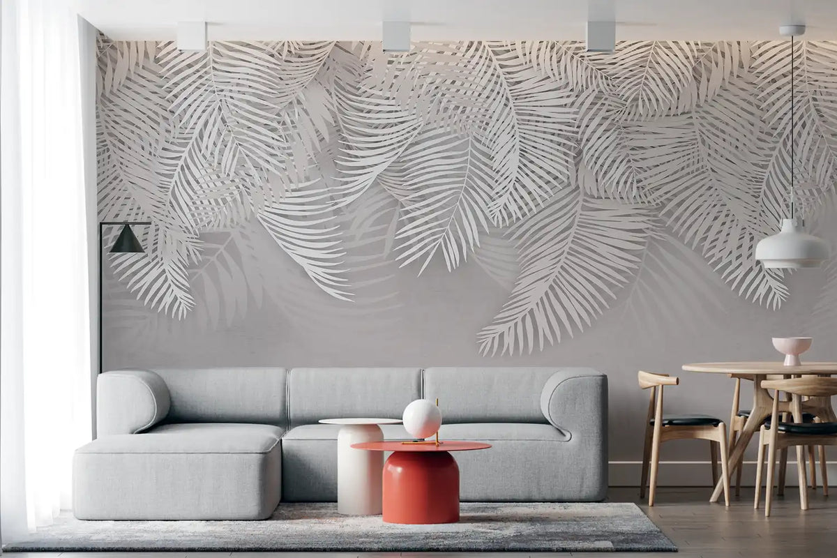 Modern living room with a large wall mural of leaf patterns.