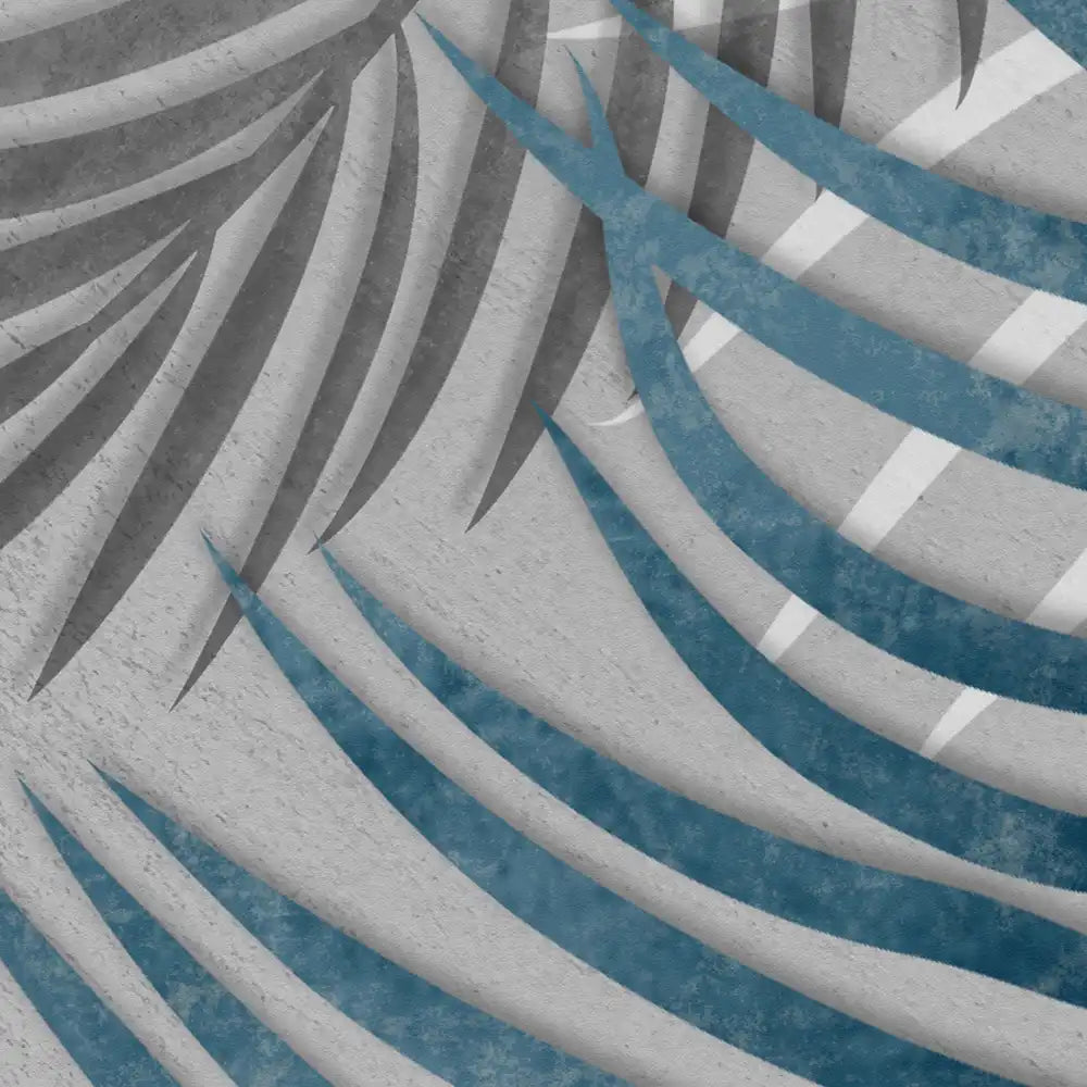 Close-up of textured fabric with blue and gray leaf pattern